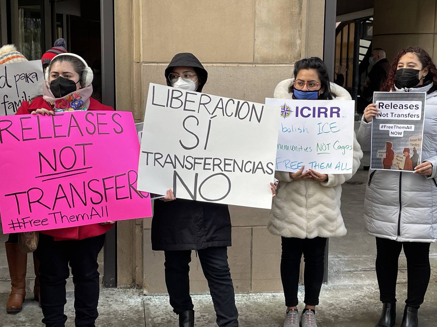 Protestors outside the office of Sylvie Renda, Immigration and Customs Enforcement Chicago Field Office director, call for immigrant detainees to be released and not transferred outside the state on Tuesday, Feb. 1, 2022.