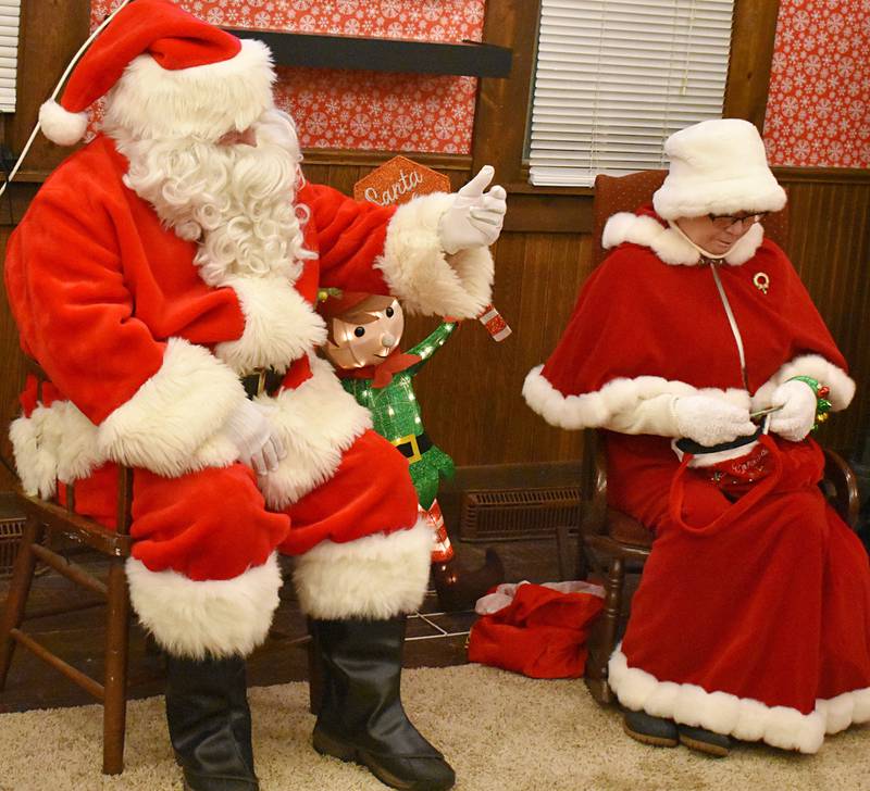 Mr. and Mrs. Claus relax in Rock Falls after they lent out their sleigh for horse rides Friday, Dec. 19, 2025, in Rock Falls.