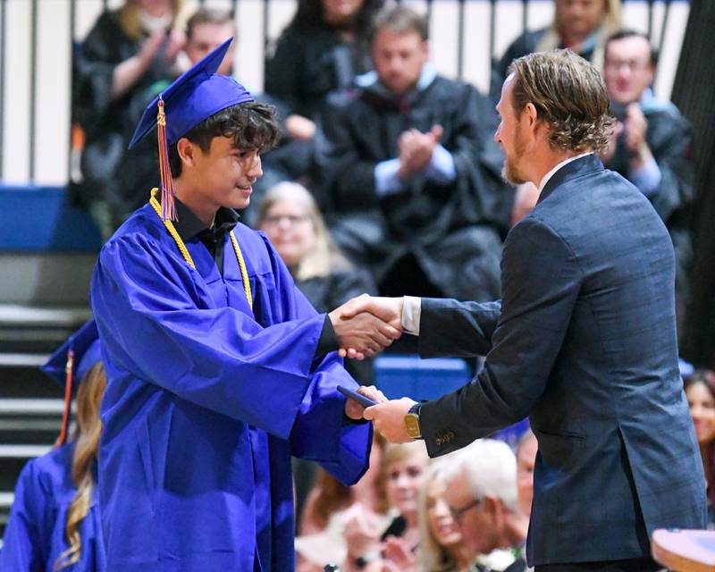 Genoa-Kingston senior John Wolcott is all smiles as he receives his diploma during his graduation ceremony Saturday, May 18, 2024, held at Genoa-Kingston High School, 980 Park Ave., Genoa.