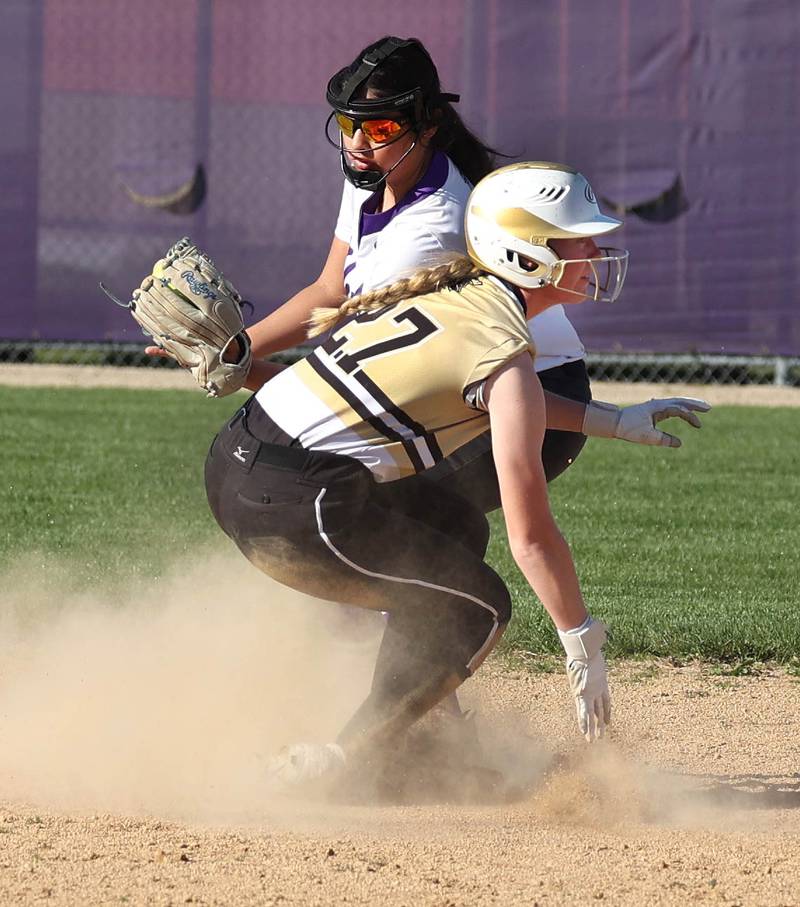 Sycamore's Keera Trautvetter slides safely into second as Rochelle's Jaclynn Lira takes the throw Monday, April 15, 2024, during their game against Rochelle at Rochelle High School.
