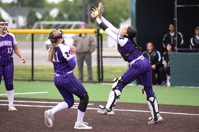 Manteno's Jaz Manau, right, catches a pop up in front of Ava Peterson during the Class 2A Coal City Regional semifinals against Bishop McNamara Wednesday, May 21, 2025.