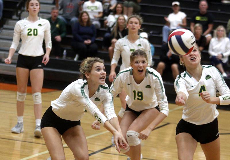 From left, Crystal Lake South’s Olivia Apt, Logan Georgy, and Bella Toniolo follow the ball in varsity volleyball at McHenry Tuesday night.