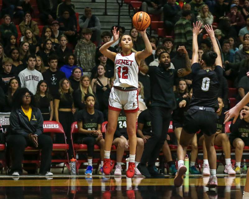 Benet's Lindsay Harzich (12) shoots a jumper from the corner during their Class 4A Bolingbrook Sectional final basketball game between Waubonsie Valley at Benet. Feb 27, 2025 in Bolingbrook.