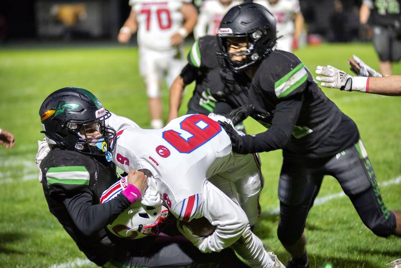Rock Falls’ Kohle Bradley hauls down Oregon’s Griffin Marlatt Friday, Oct. 14, 2022.