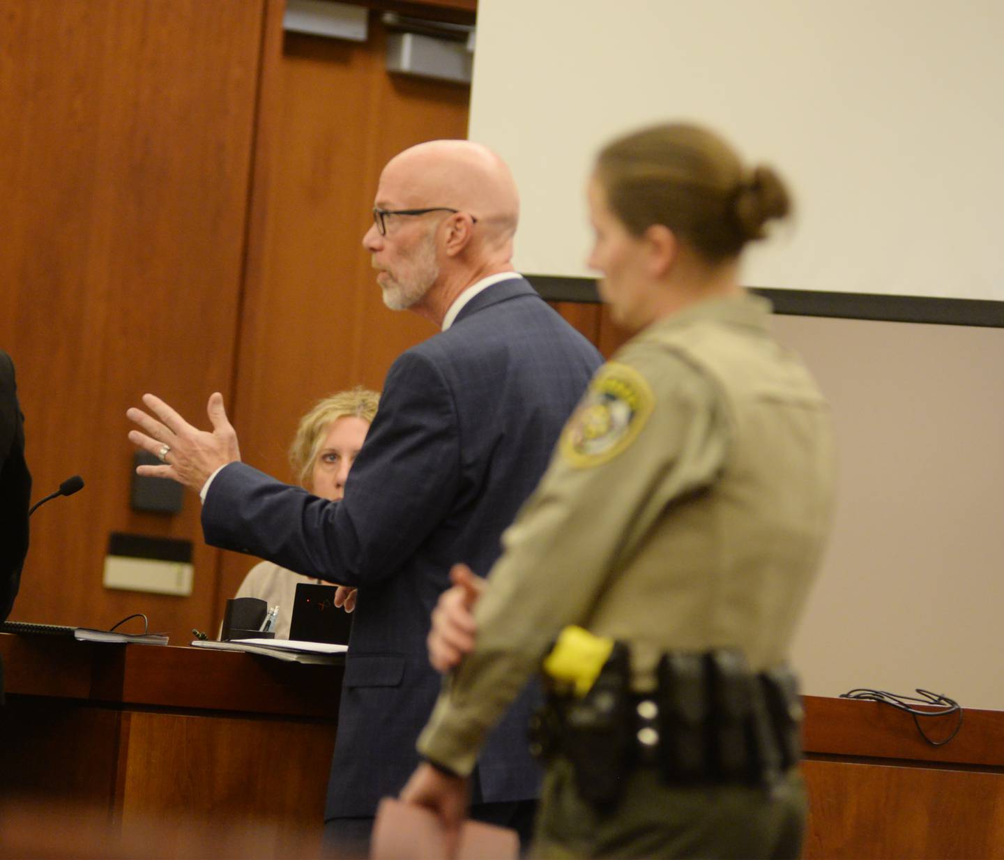Ogle County State's Attorney Mike Rock (center) addresses Judge John "Ben" Roe during a Thursday, Dec. 19, 2024 hearing for Jonathon Gounaris at the Ogle County Judicial Center in Oregon.
