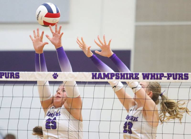 Hampshire’s Hailey Homola, left, and Layla Frederick block against Libertyville in an IHSA volleyball Class 4A Sectional Championship at Hampshire High School in Hampshire on Thursday, November 6, 2025.
