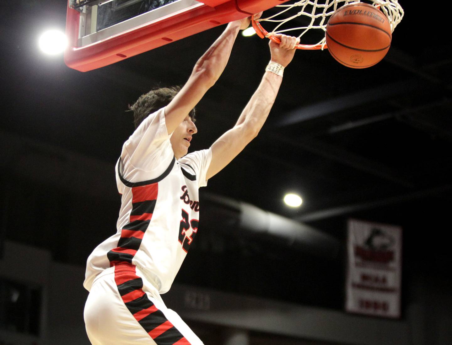 Benet’s Niko Abusara dunks the ball during the Class 4A NIU Supersectional against Rockford Auburn in DeKalb on Monday, March 6, 2023.