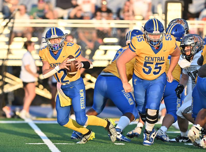 Joliet Central's Paul Slick rolls out for a pass during a non-conference game against Minooka on Friday, Sep 13, 2024 at Joliet. (Dean Reid for Shaw Local News Network)
