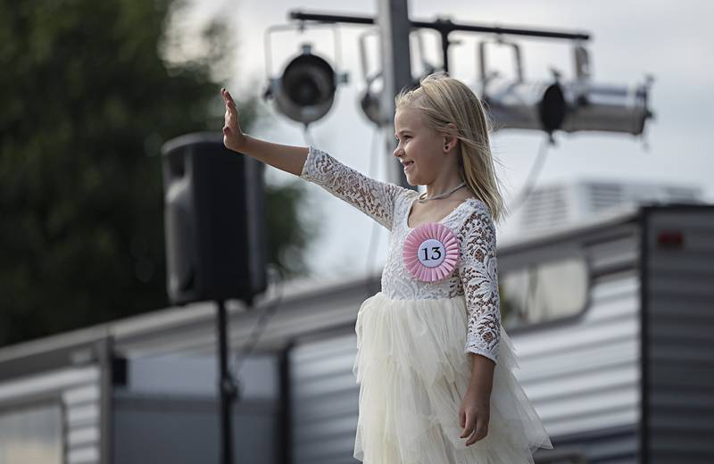 Kodi Dunham waves to the crowd Wednesday August 2, 2023 during the Little Miss Ogle County pageant.