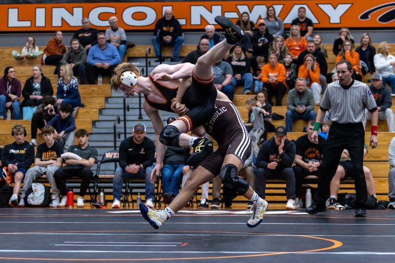Joliet Catholic’s Matthew Laird and Lincoln-Way West’s Jack Strenzo compete in the 145 pound match at Lincoln-Way West on Jan. 8, 2026.