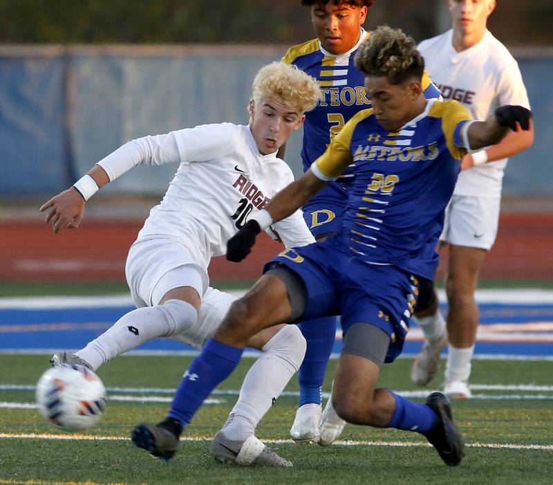 Prairie Ridge's Chase Santucci battles with Chicago De La Salle's Mario Ramirez for control of the ball during an IHSA Class 2A state semifinal soccer match on Friday, Nov. 8, 2024, at Hoffman Estates High School.