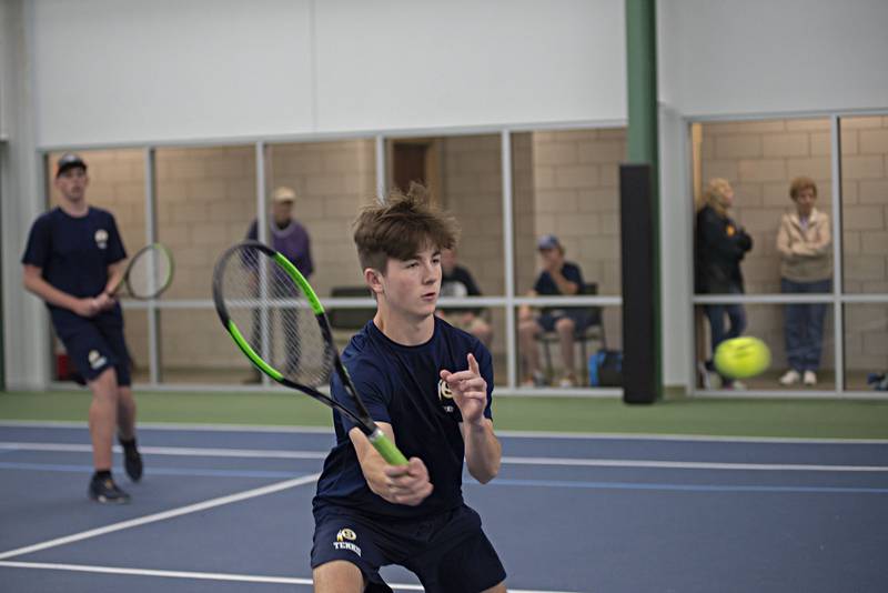 Sterling's Carter Harris plays a shot against the Dixon doubles team of Kaiser Khawaja and Alex Ulrich Thursday, May 5, 2022.