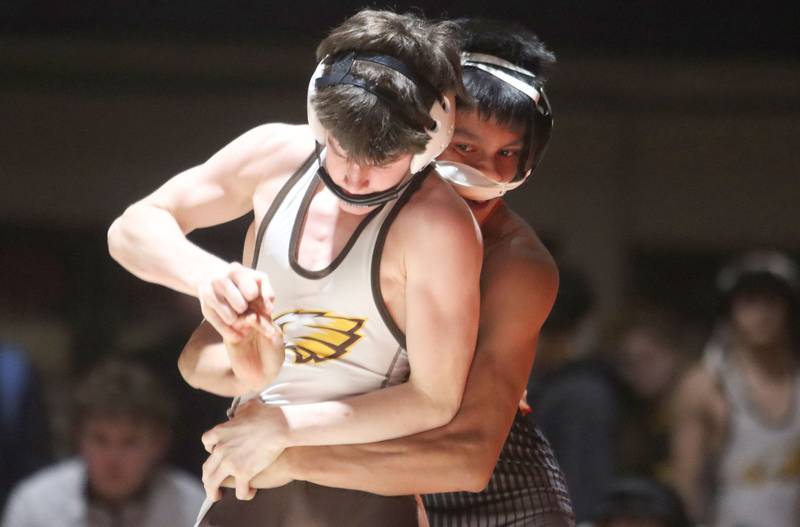 Crystal Lake Central’s Jair Viveros, back, battles Jacobs’ Nathan Flaskamp at 113 pounds in varsity boys wrestling on Tuesday, Jan. 20, 2026 at Crystal Lake Central High School in Crystal Lake.