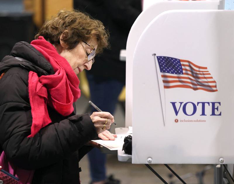 Catherine Raymond, from Delkalb, casts her ballot Tuesday, April 1, 2025, in the polling place at the Westminster Presbyterian Church in DeKalb.