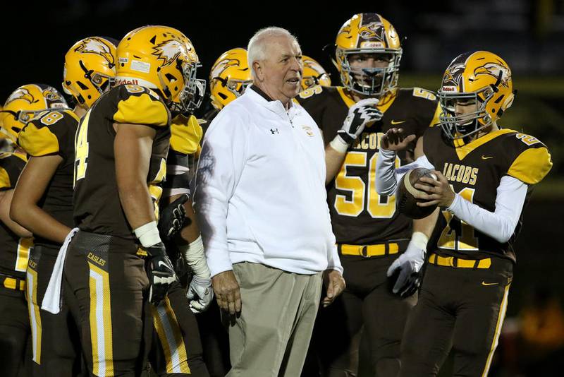 Jacobs coach Bill Mitz talks with his team during warmups on Sept. 28. As potentially the area's only Class 7A team, the Golden Eagles could have a dramatically different schedule in the IHSA's upcoming district system.