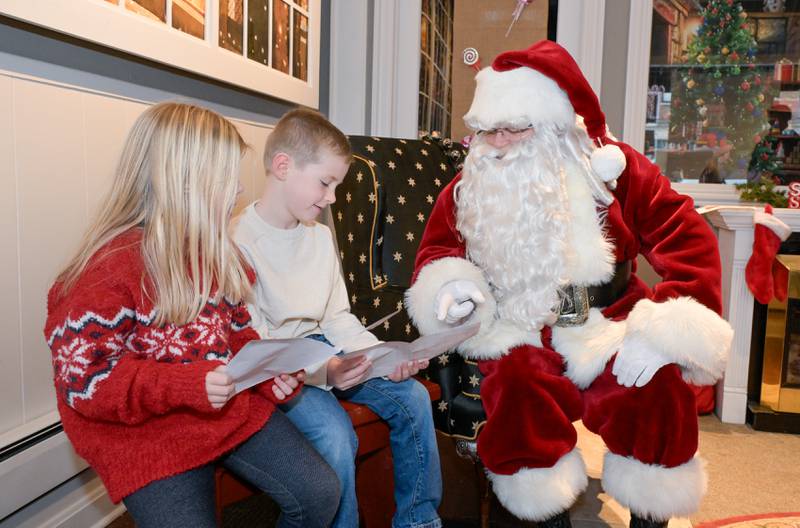 Avery, 5 and Ben Whitson, 7 of Geneva visit with visit Santa at the Geneva Visitor Center on Saturday, Dec 20, 2025 in Geneva.