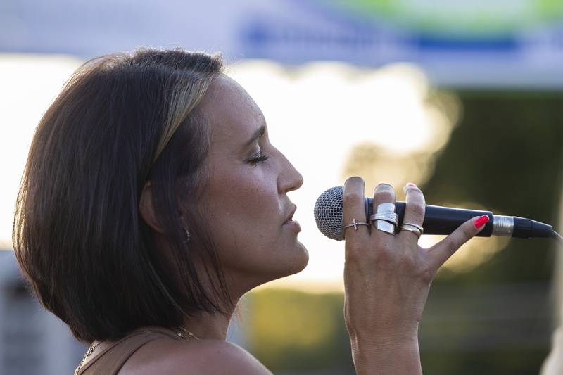 Danielle Decker sings the national anthem Tuesday, August 15, 2023 to start the Next Level Pro Bull Riding event at the Whiteside County Fair.