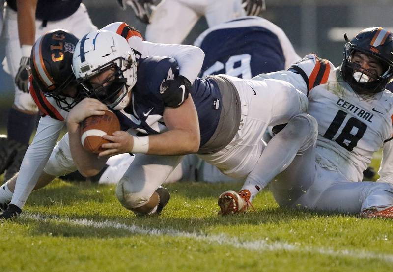 Cary-Grove's Nicholas Hissong dives with the ball for the endzone but is ruled stopped short by Crystal Lake Central during their football game at Cary-Grove High School on Friday, April 16, 2021 in Cary.