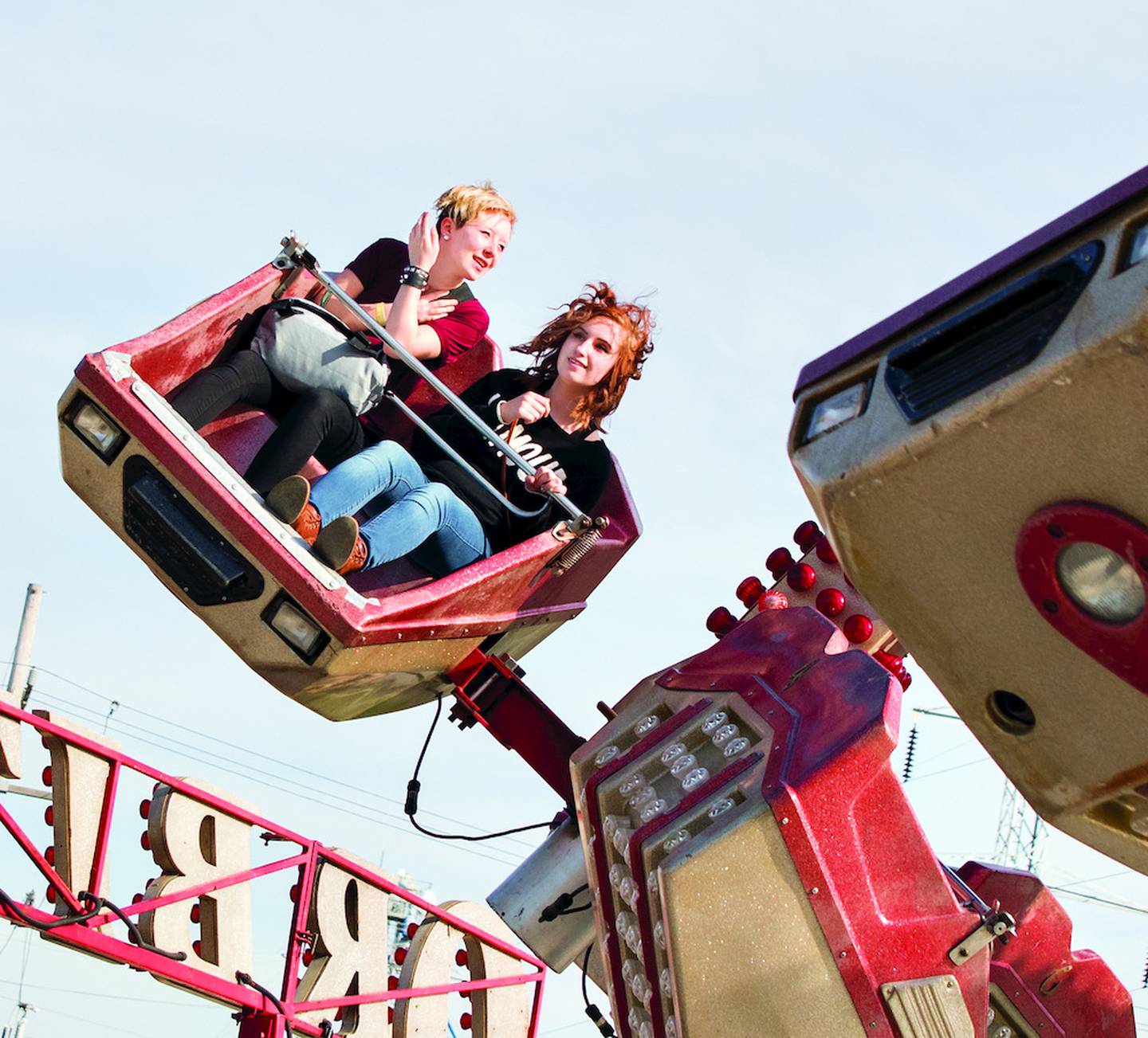 In an undated file photo, Sabrina Scott (left) and Madison Gould of Rock Falls ride the Orbiter at the St. Andrew Catholic School spring carnival along the Rock Falls riverfront.