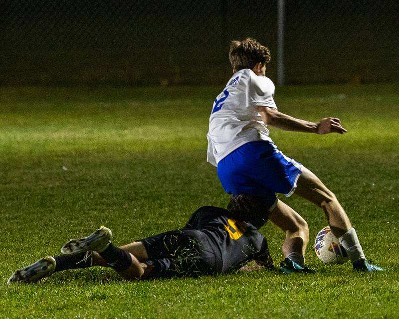 Gavin Pickert (12) of Hinckley-Big Rock maneuvers around (9) of Somonauk/Leland/Newark after he tripped in the fight of possession during the Little Ten Conference Championship match on Thursday, Oct. 9, 2025 at Hinckley-Big Rock School in Hinckley.