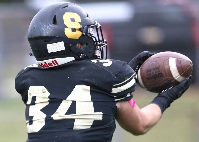 Sycamore's Joey Puleo hauls in a long pass from Elijah Meier during their Class 5A state playoff game against Sterling Saturday, Nov. 12, 2022, at Sycamore High School.