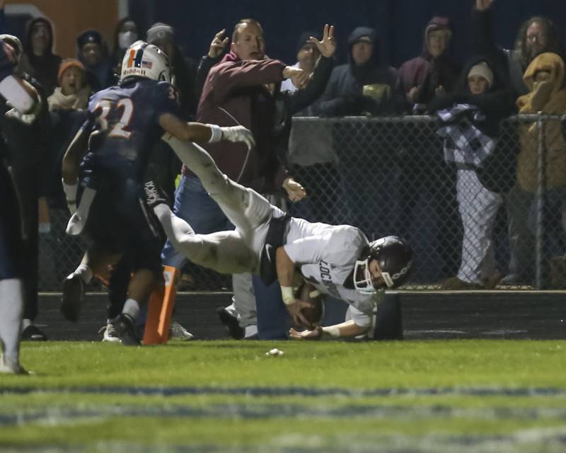 Lockport's Brendan Mecher (1) dives in for a touchdown during Class 8A semifinal football game between Lockport at Oswego. Saturday, Nov 22, 2025 in Oswego.