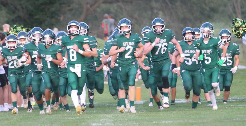 Members of the St. Bede football team run onto the field on Friday Aug. 29, 2025 at St. Bede Academy. The St. Bede Bruins hosted the Bureau Valley Storm for the first week of the football season.