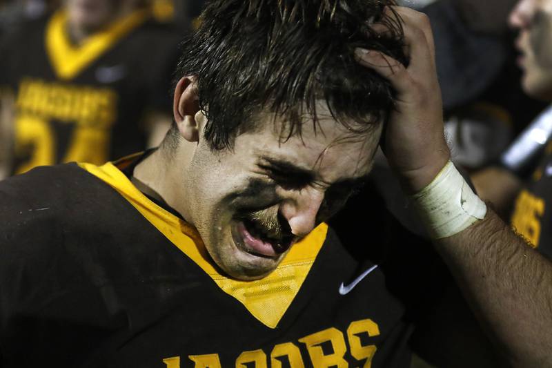 Jacobs' Kyle Koziel gathers his emotions after Jacobs lost to Brother Rice in a IHSA Class 7A first round playoff football game Friday, Oct. 28, 2022, at Jacobs High School in Algonquin.