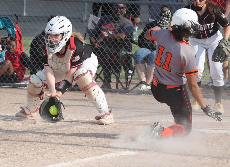 Dekalb's Sydney Myles scores the first run of the game in their Class 4A regional game against Auburn Wednesday, May 24, 2023, at DeKalb High School.