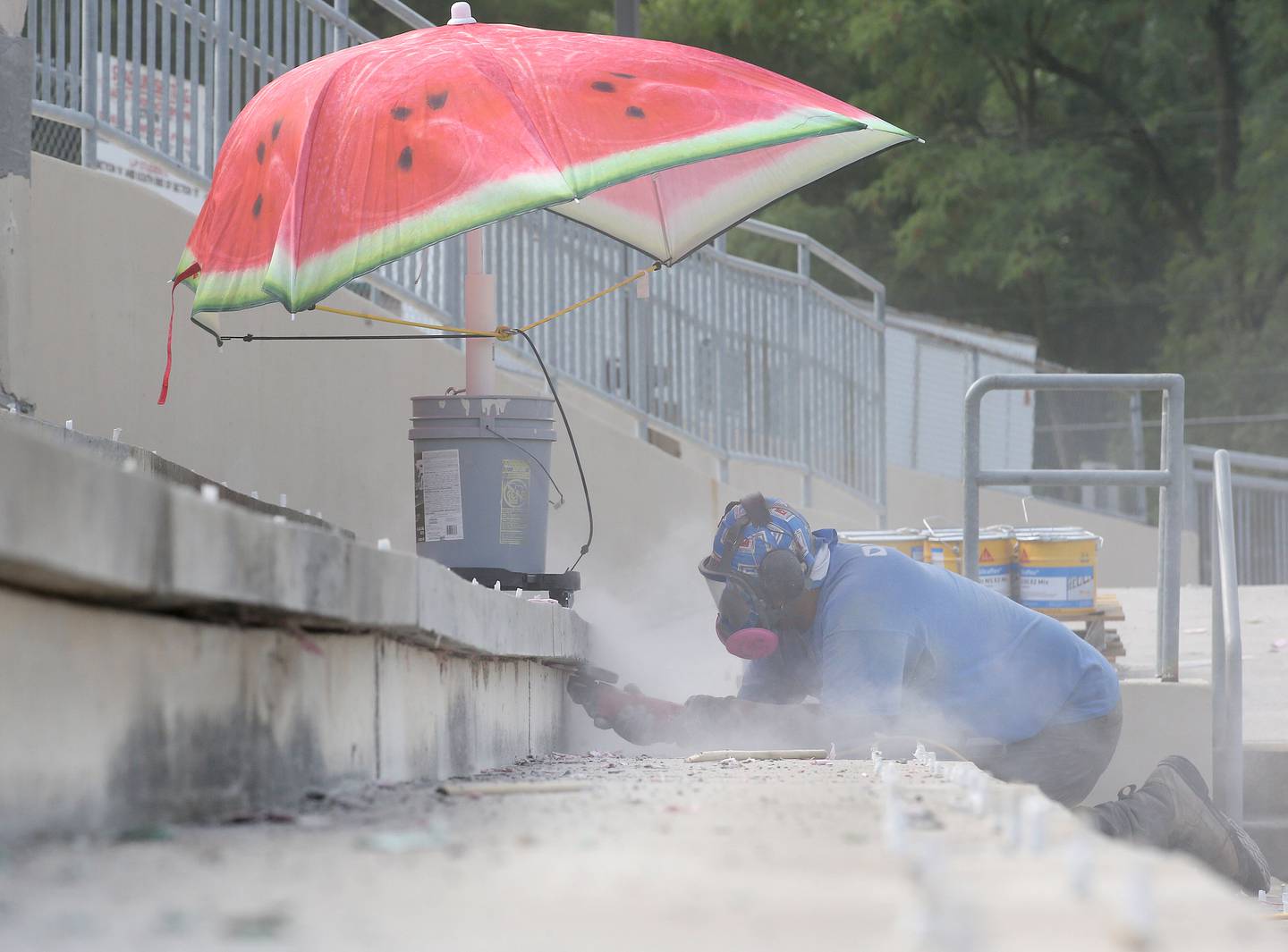 A crew member works on replacing concrete masonry in Howard Fellows Stadium on Tuesday, July 16, 2024 at La Salle-Peru Township High School. A $2.6 million restoration project at the stadium includes improvements to the walls, bathrooms, press box windows and signage. The last time the school renovated the concrete portion was in the mid-1990's. The stadium will be ready for the football season.