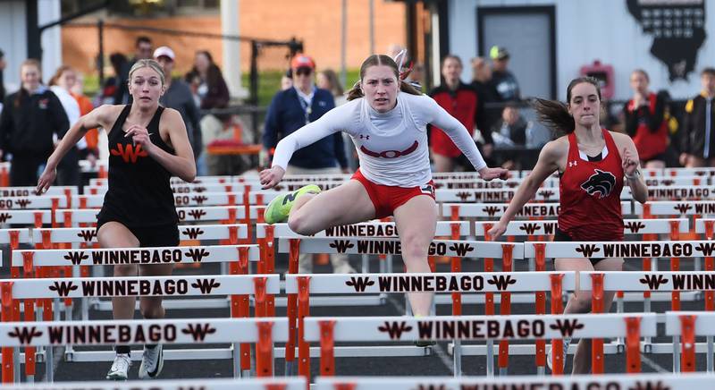 Oregon's Jillian Hammer (center) leads Winnebago's Avery Brule (left) and Indian Creek's Ally Keilman (right) as she heads to the finish line first in the 100 meters hurdles at the 1A Winnebago Sectional on Wednesday, May 13, 2026.
