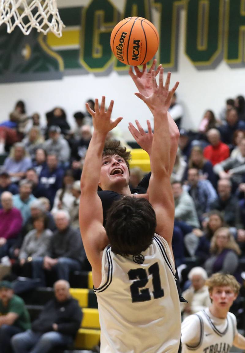 Marmion's Colin McEniry shoots the ball ove rCary-Grove's Brady Elbert during an IHSA Class 3A Crystal Lake South Regional boys basketball semifinal game on Wednesday, February, 25, 2026, at Crystal Lake South High School.