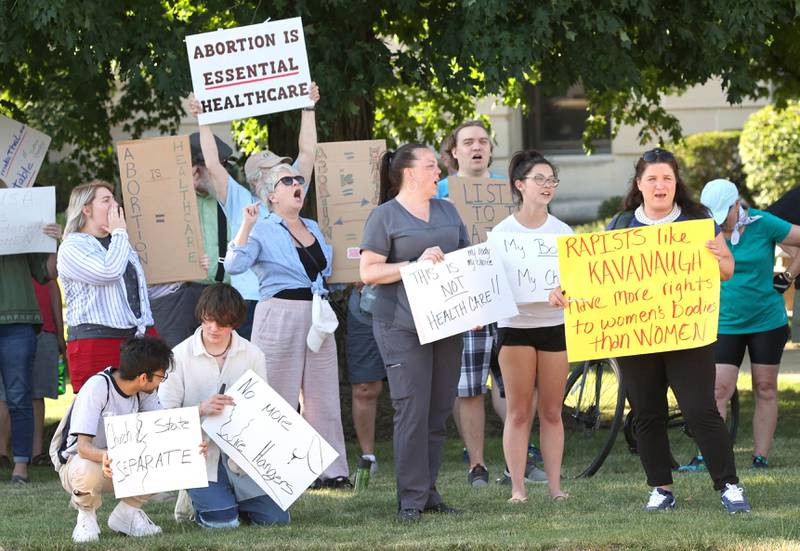 Protesters chant Friday, June 24, 2022, during a rally for abortion rights in front of the DeKalb County Courthouse in Sycamore. The group was protesting Friday's decision by the Supreme Court to overturn Roe v. Wade, ending constitutional protections for abortion.