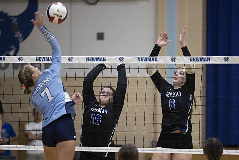 Newman’s Leah Kalina and Jess Johns go up to block a shot by Bureau Valley’s McKinley Canady Thursday, Sept. 28, 2023.