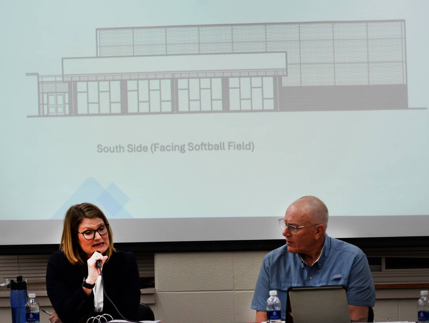Forrestville School Board president Chip Braker (right) and Superintendent Sheri Smith lead the April 15, 2026 public hearing about selling bonds to fund a $10 million sports complex addition for the Forreston Junior Senior High School.