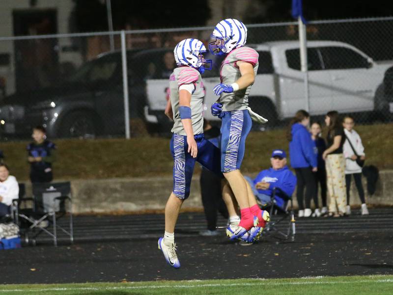 Princeton players Casey Etheridge and Gavin Lanham celebrate after scoring a touchdown against Mendota on Friday, Oct. 10, 2025 at Bryant Field in Princeton.