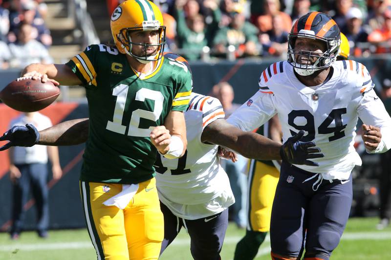 Chicago Bears defensive end Mario Edwards and outside linebacker Robert Quinn get pressure on Green Bay Packers quarterback Aaron Rodgers during their game Sunday, Oct. 17, 2021, at Soldier Field in Chicago.