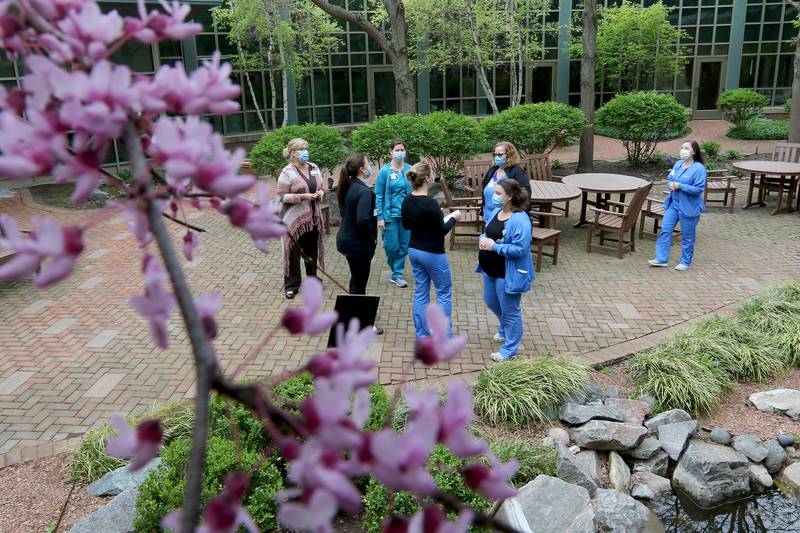 Northwestern Medicine nursing staff take a walk through a newly created wellness path during a brief 10-minute break created to facilitate staff resiliency Tuesday, May 4, 2021, at Northwestern Medicine McHenry Hospital Campus in McHenry.