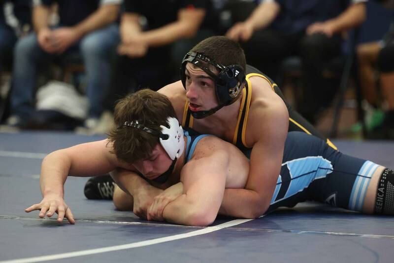 Joliet West’s Zachary Cronk works over Plainfield South’s Colin Bickett in the 175-pound match on Wednesday, Dec. 11, 2024 in Plainfield.