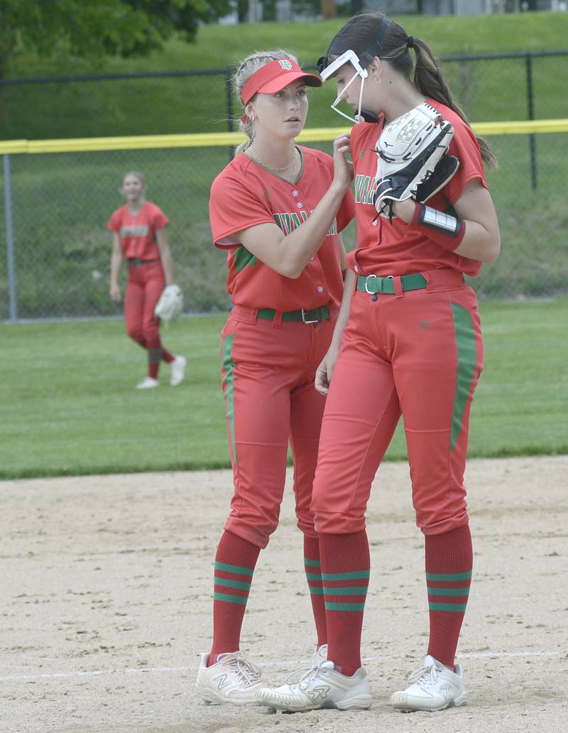 La Salle Peru’s Ava Lambert works to calm down pitcher Brie Ruppert during a rocky first inning Wednesday against Ottawa at Ottawa.