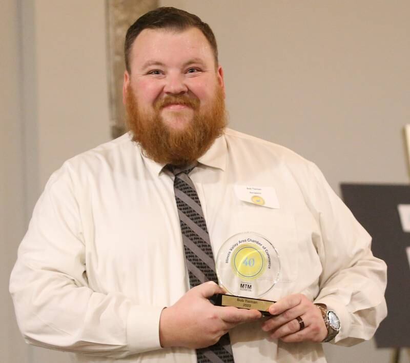 Bob Tieman, Project Manager, Tieman Builders Inc. poses for a photo with his award during the Illinois Valley Chamber of Commerce 40 Under Forty Awards Gala on Thursday, Feb. 9, 2023 at Westclox in Peru.
