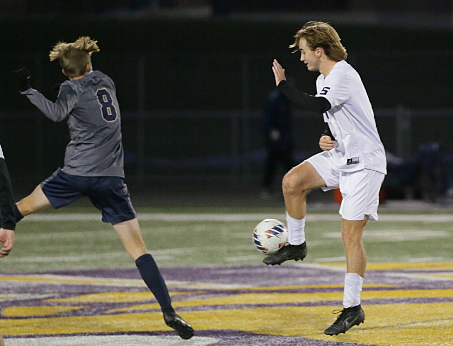 Serena's Camden Figgins (5) keeps the ball away from Quincy Notre Dame's Kannon Dickerman (8) during the Class 1A Sectional semifinal soccer match on Wednesday, Oct. 19, 2022 in Mendota.