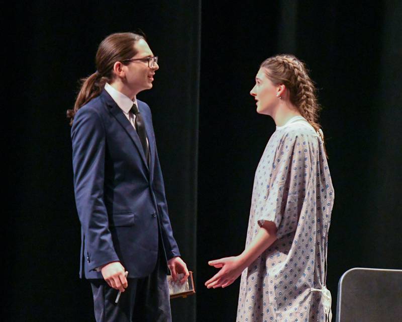 Daniel Nunez plays the character named Death, left, talks with Sam played by Ginny Bibbs as Death was sent to a therapy meeting to take her back with him during a one act play called Cheating Death held on Saturday March 22, 2025, held at Lyons Township High School south campus.