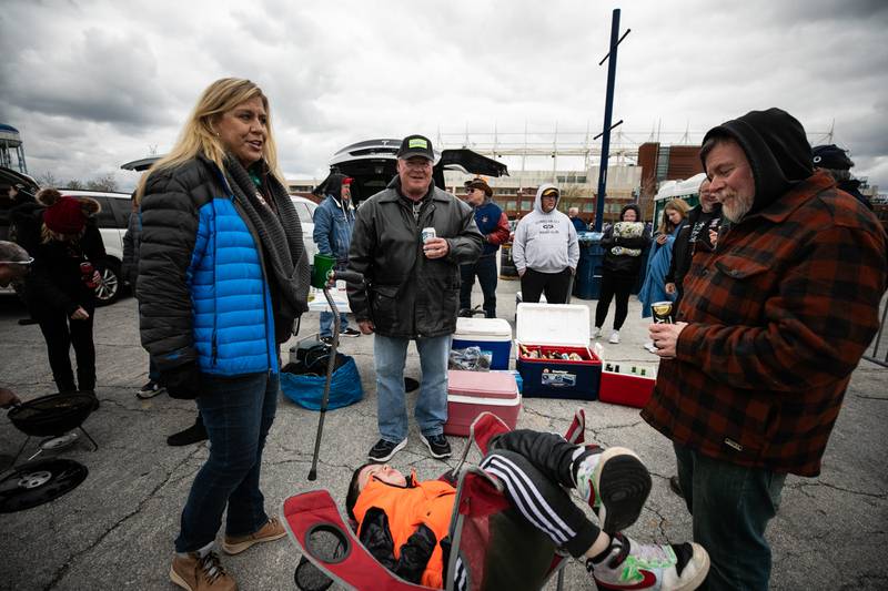 Jenny Hammerschmidt, l to r, Don Baskin, Chris Brian, and son Henry, seated, tailgate outside Seat Geek Stadium before a Chicago Hounds rugby game in Bridgeview, on Sunday April 23, 2023.