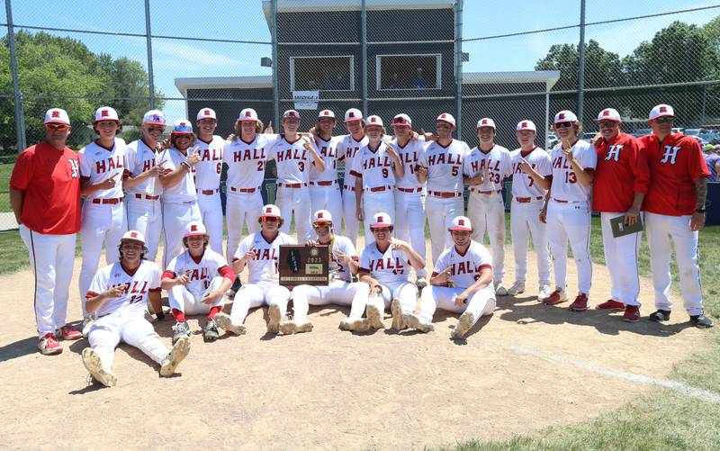Members of the Hall baseball team pose with the Class 2A Sectional plaque after defeating Sherrard during the Class 2A Sectional final game on Saturday, May 27, 2023 at Knoxville High School.