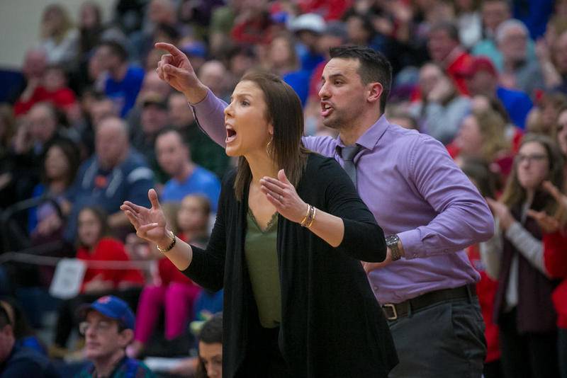 Dundee-Crown head coach Sarah Miller (left) and assistant coach James Lopez yell commands during the third quarter of the IHSA Class 4A South Elgin Supersectional game Monday at South Elgin High School. Dundee-Crown lost, 60-49.