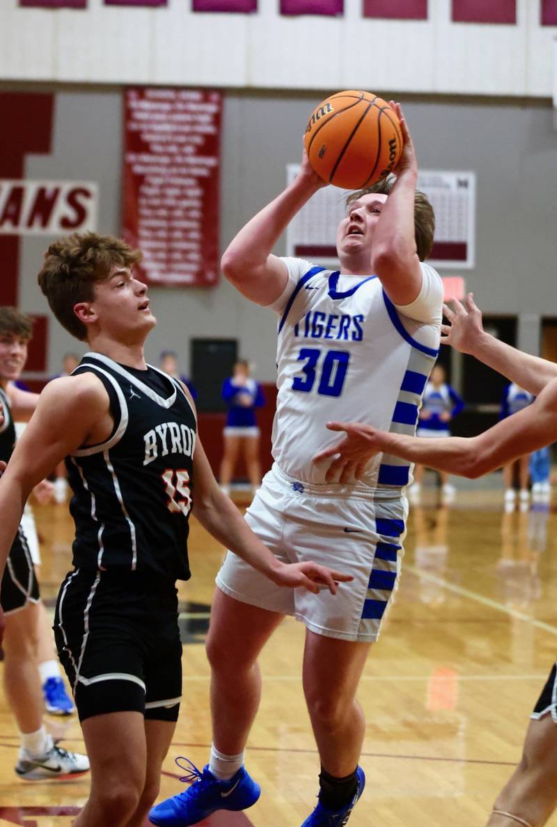 Princeton's Jordan Reinhardt shoots over  Byron's Ben Hively in Wednesday's sectional semifinals at Marengo. Princeton won 46-42 to advance to Friday's championship against Rock Falls.