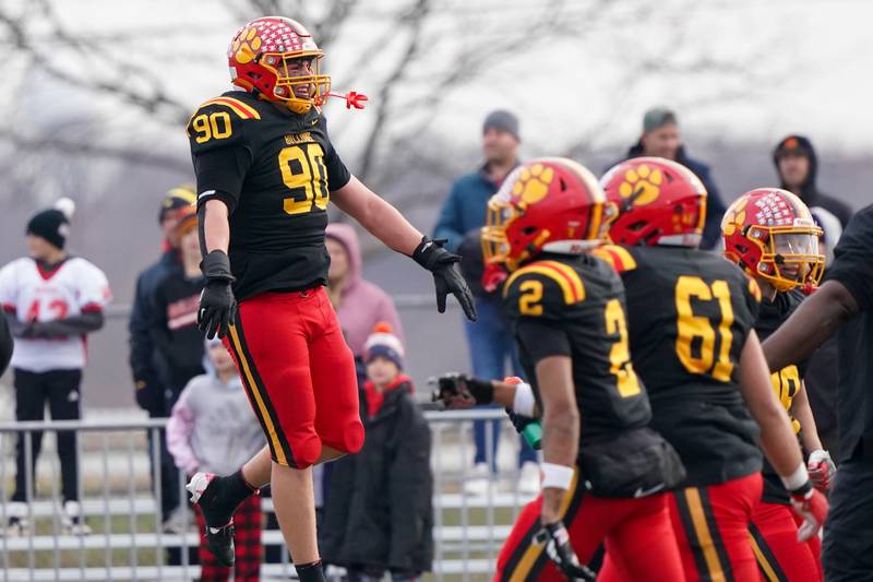 Batavia’s Gavin Pecor (90) celebrates after deflecting a Downers Grove North field goal attempt during a class 7A quarterfinal playoff football game at Batavia High School on Saturday, Nov. 16, 2024.