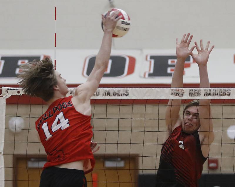Huntley’s Jacob Rutkowski (right) tries to block the spike from Grant’s Evan Sigler during a nonconference boys volleyball match on Thursday, May 21, 2026, at Huntley High School.