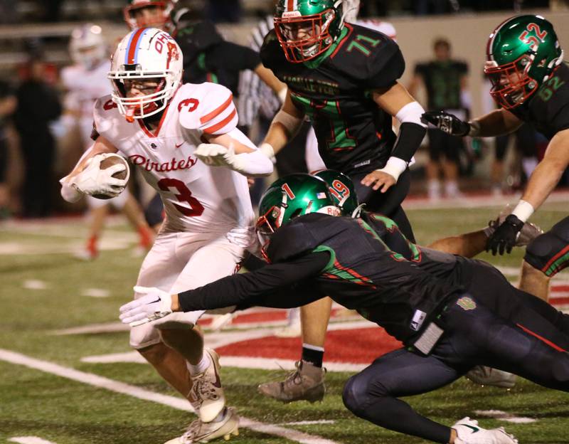 Ottawa's Hayden Swett runs the football as he is brought down from behind by L-P's Noah Zebron on Friday, Oct. 6, 2023 at Howard Fellows Stadium.